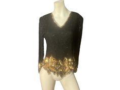 "Vintage bead and sequin top, tag says Lauence Kazar, sz L, 100% silk. Top zips up the back, has shoulder pads, V neck, comes to points at the bottom. Top is in great condition, measurements are shoulder to shoulder 16\" bust up to 36\" waist up to 30\" length 23\" sleeve length 22\"" Gold Long Sleeve Top For Evening, Gold Tops For Evening Wear In Fall, Gold Sequin Tops For Fall, Gold Sequined Long Sleeve Blouse, V-neck Sequin Blouse For Evening, Gold Long Sleeve Blouse With Sequins, Gold Fitted Top For Evening, Fitted Gold Top For Evening, Elegant Gold Holiday Tops