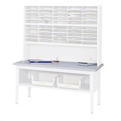 a white desk with two drawers and a book shelf on the top, next to some books