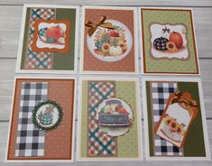 four cards with pumpkins, sunflowers and other items on them are laid out