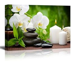 white orchids and candles with spa stones on the table canvas wall art print - ready to hang