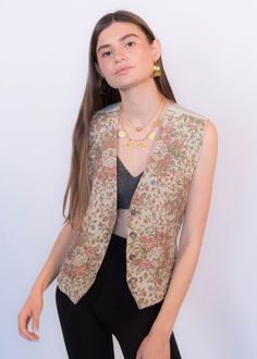 "Vintage 90s Liz Claiborne floral carpet vest. This classic 90s vest comes in the prettiest dusty pink floral print. V-neckline. Sleeveless. Back adjustable belt buckle. Front button fastening. Fully lined. We kindly ask that you please view all measurements for comparison so you can get your desired fit. * Brand: Liz Claiborne * Decade: 1990s * Fabric: 57% Rayon, 43% Cotton * Lining: 100% Rayon back & lining * Color: Light Beige with Dusty Pink Floral Print C O N D I T I O N * Excellent vin Retro V-neck Vest For Spring, Spring Floral Print V-neck Vest, Vintage V-neck Vest For Spring, Retro V-neck Spring Vest, Spring V-neck Retro Vest, Retro Spring Vest, Spring Vintage Vest, Fitted Vintage V-neck Vest, Fall Floral Print Sleeveless Vest