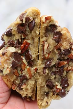 two pieces of chocolate chip cookies in the palm of someone's hand, one half eaten