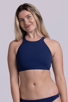 The Kaylee is a high neck, full coverage bikini top with thick straps in the back for the best support. This swimsuit top can double as a sports bra - rock the Kaylee at a hot yoga class or at swim practice - whatever suits your style! Features: Good for: Swim, Water Polo, Surfing, paddling, ocean activities, pool activities, lifestyle Fixed-Back Thick Strapped Swim Top + Sports Bra Full Coverage High Impact Unpadded Tagless Lined for maximum privacy Chlorine proof 2-way stretch Reinforced stitc Swim Practice, Pool Activities, Ocean Activities, Water Polo, Hot Yoga, Yoga Class, 2 Way, Swim Top, Swimsuit Tops