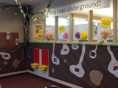 a classroom decorated with flowers and bulletin boards