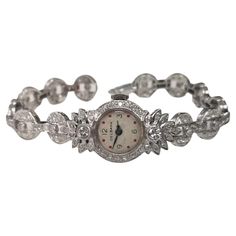 Art Deco "Delbana" Platinum Diamond Watch-Bracelet *Motivated to Sell – Please make a Fair Offer* Specifications: main stone: ROUND CUT DIAMONDS diamonds: 19 PIECES carat total weight: APPROX 3.05 cts. color: G clarity: VSI1-2 brand: Delbana metal: PLATINUM type: WATCH weight: 34.5 Grams LENGTH: 7" with a double clasp for safety Platinum Wedding Watch, Round, Wedding Platinum Watches, Round Shape, Platinum Diamond Watch For Wedding, Platinum Diamond Wedding Watch, Platinum Wedding Watch, Wedding Platinum Watches, Evening Round Watch With Jubilee Bracelet, Wedding Diamond Watch With Jubilee Bracelet, Evening Watches With Jubilee Bracelet