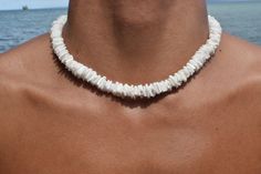 Elevate your summer style with our exquisite Natural White Clam Shell Puka Beach Summer Handmade Necklace. Perfectly crafted for men, women, and teens, this stunning accessory is more than just a necklace--it's a piece of paradise you can wear. Features: Authentic Clam Shell Puka Beads: Each necklace is handmade with natural white clam shell puka beads, ensuring unique variations and a genuine beachy feel. Versatile Design: The simple yet elegant design makes it a versatile piece, ideal for beach outings, summer festivals, or adding a touch of coastal charm to any outfit. Size Variations: Choose from a range of sizes, from chokers to longer lengths. Secure lock: We use a barrel/screw type lock, which is proven to be sturdier and have a cleaner look. Unisex Appeal: Suitable for men, women, White Heishi Beads Jewelry For Vacation, White Beachy Shell Necklace For Gift, Beachy White Shell Necklace Gift, White Shell Necklace, Chips Necklace, Puka Shell Necklace, Beach Necklace, Surfer Necklace, Beach Anklets