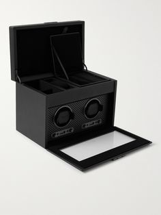 When silversmith Mr Philipp Wolf noticed customers were more interested in his fine leather cases than his silver, he decided to give packaging more attention, the rest, as they say, is history. With five generations and over 185 years of design, this 'Axis' watch winder, with its patented technology and custom powder-coated plating, is a pinnacle of the brand's innovation. It's handcrafted from vegan leather and engineered to wind your timepieces with an LCD control panel on the front, so you c Luxury Black Watch Accessories With Polished Finish, Modern Black Watch Accessories With Box, Black Polished Rectangular Watch Accessory, Black Rectangular Watch Accessory With Polished Finish, Luxury Black Watch Accessories For Gift, Luxury Black Watch Accessories As Gift, Elegant Black Watch Accessories With Box, Wolf Colors, Mens Designer Watches