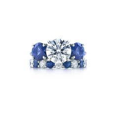 an engagement ring with blue sapphires and diamonds