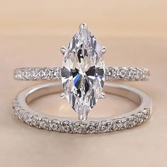 an oval cut diamond ring with pave band