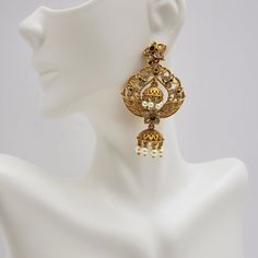 This beautiful earrings set has an excellent finish and gives out an exquisite sense of style. If you are looking for an amazing Fashion Jewelry set for special occasions such as Anniversary, Engagement, Party, Wedding, or for gifting, then your search ends here. Handmade Indian Temple Jewelry, best to wear it for traditional ceremonies or Indian wedding. This bridal jewelry has an ethnic finish. It has Cubic Zircon stones with semi-precious ruby and emeralds. It is a Bollywood style one gram je Elegant Jeweled Chandbali Pearl Earrings, Wedding Chandbali Bridal Earrings With Jewels, Wedding Bridal Chandbali Earrings With Jewels, Elegant Jeweled Chandelier Earrings For Festive Occasions, Traditional Jeweled Pearl Earrings For Party, Elegant Gold Jewelry Sets With Drop Earrings, Glamorous Gold Plated Earrings For Weddings, Exquisite Pearl Drop Bridal Earrings For Evening, Elegant Metal Jewelry Sets For Celebrations