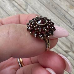 Vintage Bohemian GARNET Ring US 6.25 in Sterling Silver. Stamped "Silver" on the inside. Was certainly gold plated Sterling or Vermeil .. looks silver but may be some remnants of gold wash. Truly beautiful antique garnet cluster ring! Excellent condition . Makes a beautiful unique gift.  Will come in a small red ring box ready to gift.  Free shipping in the USA. All sales final . Fine Jewelry Garnet Cluster Ring, Fine Jewelry Round Cluster Ring With Garnet, Victorian Cluster Ring With Multi-stone, Victorian Multi-stone Cluster Ring, Antique Multi-stone Cluster Ring, Antique Gemstone Cluster Ring For Anniversary, Antique Multi-stone Cluster Jewelry, Heirloom Garnet Cluster Ring With Gemstones, Vintage Garnet Rings With Polished Finish