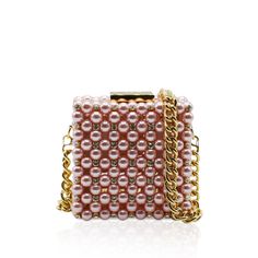 Handcrafted with care in Italy with up to 8 hours of hand work, this clutch is a masterpiece of luxury. This clutch boasts a metal frame available in gold or silver, delicately adorned with Artisan pearls and sparkling crystals, catching the light with every movement.Luxurious leather graces the interior, offering both sophistication and functionality. Material: Metal Frame, Artisan pearls and sparkling crystals, Leather Unlined Height: 10 cm Width: 10 cm Depth: 6 cm Complete with a versatile 80 Chic Pearl Evening Bag As Gift, Luxury Pearl Evening Bag As Gift, Chic Pearl Evening Bag For Gift, Luxury Evening Clutch With Pearl Handle, Luxury Pearl Evening Bag For Party, Gold Pearl Evening Bag For Events, Luxury Evening Bag With Pearl Handle For Events, Luxury Formal Clutch With Pearl Handle, Luxury Party Clutch With Pearl Handle