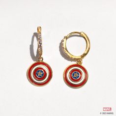 With our Marvel's Captain America Hoops, you can add some Super Hero style to your everyday look. The hoops feature Captain America's iconic shield, with vibrant red, white, and blue enamel detailing that's sure to make a statement. The glimmering stones that line the hoops add an extra level of chicness, making these earrings a true standout. Captain America Jewelry, Avengers Jewelry, Marvel Earrings, Panther Earrings, Avengers Icon, Marvel Jewelry, Rose Gold And Silver, Wakanda Forever, Marvel Captain America