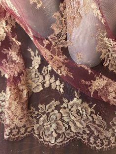 an image of a woman's dress with gold lace on the bottom and sides