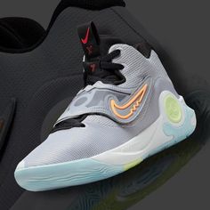 the nike zoom basketball shoe is shown in grey and orange