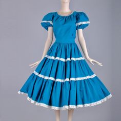 Era: 50s-60s Color(S): Blue/White/Silver Closure: Top: None/Skirt: Metal Zip Material(S): Unmarked: Cotton Blend Condition: 6 Modern Fit: S/M Shoulder: 15.5 Sleeve: 8 Bust: 38 Waist: 36/27 Hips: Free Length: 22/30.5 Lined: No Stretch: No Clipped On Model: Yes Model: 5'10" 31.5/23.5/33.5 Stock : 1312-2 Notes - Eyelet Lace Accents - Pouf Shoulders - Silver Ric Rac Trim - Full Swing Circle Skirt - No Button (Intentional) - Discoloration On The Hem Area Of Skirt - See Photos Square Dance Dresses, Boho Bridal Dress, Victorian Fashion Dresses, Patio Dress, Skirt Top Set, Simple Summer Dresses, Square Dance, Ankle Length Skirt, Edwardian Dress