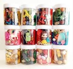 a stack of plastic containers filled with different types of toys