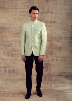 This Jodhpuri Jacket is in Banarasi Silk with Gold zari and Resham weaving. It can also be paired with any pastel colour Kurta Set or any pastel colour Slim Pants. Brand: Panache Haute Couture Availability: Online and In-store Delivery Time: 4-6 Weeks Fabric: Jacket - Banarasi Silk Customisation: Limited Colour Options Available. For more colour options in the fabric please contact our team through WhatsApp+61470219564 Disclaimer: The model is of Size 40 and is 5 feet 10 inches tall and the mode Festive Pista Green Nehru Jacket For Designer Wear, Spring Reception Long Sleeve Kurta, Spring Wedding Green Bandhgala, Pista Green Nehru Jacket With Chikankari Embroidery, Formal Spring Nehru Jacket With Zari Work, Green Nehru Jacket With Zari Work For Reception, Traditional Pista Green Nehru Jacket With Chikankari Embroidery, Green Bandhgala With Zari Work For Spring, Spring Reception Bandhgala With Zari Work