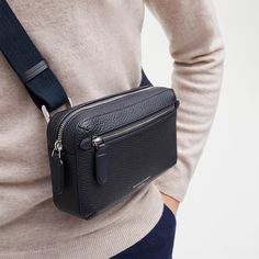 Designed for life on the move, our men's Reporter CompactCrossbody Bag is smart, durable, and lightweight.Handcrafted from full-grain leather, the refined design providesa smart statement that's stylish yet understated. With a softlystructured body, the cotton lined interior has ample room to storeall the essentials, alongside a convenient slip pocket forseparating smaller items. Maximising functionality within thecompact frame, a zipped compartment with an internal slip pocket atthe front exter Men Handbag, Crossbody Phone Bag, Compact Bag, Best Purses, Billfold Wallet, Rfid Wallet, Aspinal Of London, Webbing Strap, Wallet Gifts