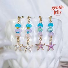 Add a touch of whimsy to your outfit with these adorable pastel stone starfish earrings! 🐚💫 #HandmadeJewelry 💖𝐎𝐕𝐄𝐑𝐕𝐈𝐄𝐖: 🧡 Earrings are made with an assortment of glass beads. 💙 Beads may vary slightly. 💚 This listing is for 1 pair of earrings. 💛 Please note that because the item is handmade/ or due to the lighting, it may differ slightly from those in the photos (please allow a 2% difference). ✨𝐇𝐢𝐠𝐡𝐥𝐢𝐠𝐡𝐭𝐬: ✨ Handmade craftsmanship: Each pair of earrings is meticulously h Handmade Starfish Earrings For Beach, Beach Drop Earrings With Natural Stones, Handmade Star Shaped Jewelry For Vacation, Handmade Star-shaped Jewelry For Vacation, Beach Star Charm Earrings, Beach Earrings With Star Charm, Star-shaped Earrings For Beach With Pierced Ears, Star Shaped Earrings With Star Charm For Beach, Star-shaped Earrings With Star Charm For Beach