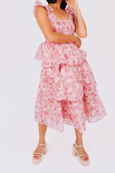 This fun and flirty dress will take you Through The Years with its ruffle straps and smocked bodice. The tiered design adds a playful touch, and the floral pattern adds a dash of whimsy. Perfect for any occasion, this dress will have you looking and feeling confident. Details Ruffle straps Smocked bodice Tiered Floral pattern Sizing Approximate measurements: SIZE LENGTH BUST Small 45" 30" Medium 46" 32" Large 47" 34" Fabric has stretch in the bodice Model is 5’7 wearing small Material 100% Polye Feeling Confident, Flirty Dresses, Dresses For Sale, Smocking, Apparel Accessories, Floral Pattern, Bodice, Gap, Floral