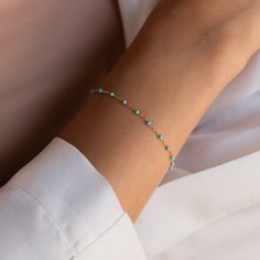 Add a pop of beautiful color to your jewelry collection with our Turquoise Beaded Bracelet. The dainty boho style and calming turquoise stones are easy for pairing with other pieces to create your own unique bracelet stack. Material: High Quality Solid 925 Sterling Silver. Finish: Sterling Silver ∙ 18K Gold Featuring 1mm Turquoise Beads across the bracelet with 6mm between each bead. The bracelet is adjustable from 6 to 7.5 inches SKU: RR-BR027 Trendy Turquoise Bracelets With Tiny Beads, Hand-strung Turquoise Minimalist Bracelets, Minimalist Turquoise Hand-strung Bracelets, Turquoise Minimalist Hand-strung Bracelet, Minimalist Turquoise Bracelet With Gemstone Beads, Minimalist Beaded Turquoise Bracelet, Minimalist Turquoise Beaded Bracelets, Minimalist Turquoise Beaded Bracelet, Turquoise Beaded Bracelets For Everyday Wear