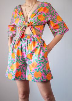 Get ready to deliver some serious vitamin C vibes with our orange garden print! Now available as a pair of shorts or as the most magical, bold and colourful two-piece set for a head to toe tropical outfit that won't go unnoticed! (Top / Shorts sold separately) -High-rise elastic waist -Pockets -Orange Garden print -Comfy wide leg cut -Part of a coord set // Matching top: https://www.etsy.com/listing/711016750/orange-garden-print-organic-cotton-wrap?ref=shop_home_active_45&frs=1&crt=1 -Organic Co Summer Printed Loungewear Shorts, Printed Loungewear Shorts For Summer, Orange Beachwear Shorts For Spring, Printed Lounge Shorts For Summer, Orange Relaxed Fit Shorts For Vacation, Multicolor Printed Shorts For Loungewear, Multicolor Printed Loungewear Shorts, Spring Printed Shorts For Loungewear, Vibrant Shorts For Vacation