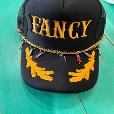 Vibes Hat Company gold trucker hat chain with lightening bolt charms. Each chain has lobster claws so you can add extra flair to your favorite trucker hats! Hat Chain, Lobster Claws, Graphic Tee Dress, Custom Ideas, Girls Boutique, Embroidery Patches, Bar Earrings, Hats For Sale, Bar Accessories