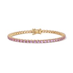 Enhance your jewelry collection with the captivating beauty of our Pink Sapphire Tennis Bracelet. Adorned with vivid pink gemstones, this exquisite piece radiates elegance and charm. Available in 14K Yellow Gold and White Gold Carat weights are reflective of a 7in bracelet. Shorter lengths will have lower carat weights that those listed. Gemstones are natural, therefore colors may vary Elegant Rose Gold Bracelet For Formal Occasions, Elegant Pink Gold Bracelet For Formal Occasions, Yellow Gold Tennis Bracelet With Sparkling Stones, Pink Cubic Zirconia Bangle Bracelets, Elegant Pink Jewelry With Vvs Clarity, Gold Brilliant Cut Pink Sapphire Jewelry, Fine Jewelry Bracelets With Round Cut Gemstone, Pink Gold Jubilee Bracelet Jewelry, Classic Pink Tennis Bracelet With Jubilee Style