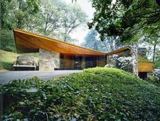 an image of a house in the middle of some trees and bushes with text over it that says studioblackinters canberra, australian capital territory