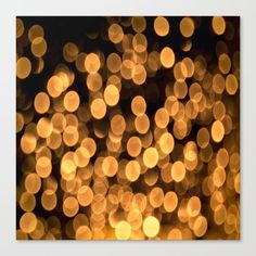 blurry lights are seen in this photograph canvas print, which is mounted on a wall