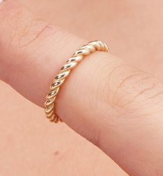 Elevate your style with our exquisite Gold Twist Ring, a true masterpiece of artisan craftsmanship. This stunning piece is meticulously handcrafted to add a touch of luxury and sophistication to your everyday or special occasion look. 🌟 Key Features 🌟 🔸 Material: 14K Gold 🔸 Design: Unique Twist Pattern 🌟 Product Details 🌟 Our Gold Twist Ring is expertly fashioned from high-quality 14K gold, ensuring long-lasting beauty and durability. The unique twist pattern of this ring adds a captivating element to your ensemble, making it a conversation starter and a treasured addition to your jewelry collection. 🌟 Versatile Elegance 🌟 This ring's timeless design allows it to effortlessly transition from day to night, making it the perfect accessory for any occasion. Whether you're dressing up Timeless Thick Band Jewelry As A Gift, Timeless White Gold Jewelry With Thick Band, Luxury Recycled Gold Rings, Tarnish Resistant, Minimalist Thick Band Diamond Cut Jewelry, 14k Gold Open Ring Jewelry For Promise, Luxury Recycled Gold Rings Tarnish Resistant, Luxury Tarnish Resistant Rings In Recycled Gold, Luxury Recycled Gold Rings, Elegant White Gold Jewelry With Thick Band