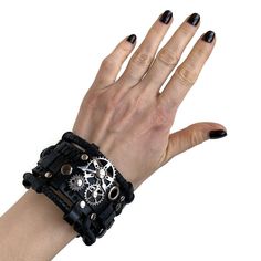 This black gothic leather bracelet was designed in the steampunk and rock style. The bracelet is made of genuine cow leather and decorated with metal parts. Bracelet's width is about 1.97 in (5 cm) Bracelet's length is about 7.9 in (20 cm) It fits the wrist 7.1-8.3 in (18-21 cm) Please measure your wrist to make the correct choice CARE No special care is required. Avoid chemical exposure including perfumery. If you need a custom order please let me know and I will try to do my best to prepare it Black Gothic Bracelets For Biker Events, Black Biker Style Bracelets For Biker Events, Black Leather Wristband For Festival, Punk Leather Strap Bracelets, Adjustable Black Biker Jewelry, Black Gothic Festival Wristband, Gothic Black Wristband For Festivals, Black Gothic Leather Bracelet As A Gift, Black Gothic Leather Bracelet For Gift