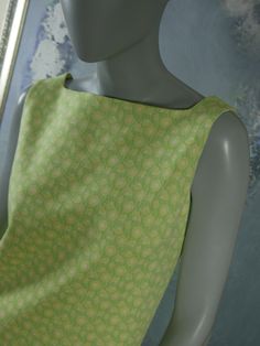 This 1960s Swedish vintage shift dress has a delicate yellow floral pattern on a mint green background. The sleeveless slip-on dress has a square bateau neckline and a green polyester lining. Bust = 37 inches (93.98cm) Waist = 37 inches (93.98cm) Hips = 37 inches (93.98cm) Dress Length = 35.5 inches (90.17cm) Brand label: Ajco (Made in Sweden) Size: 6/8 US/UK Material: Diolen Polyester Condition: Excellent (clean, soft, and supple, with no stains, tears, wear spots, or weaknesses in the seams) - Vintage Green Square Neck Dress, Retro Green Square Neck Dress, 1960s Shift Dress, Vintage Shift Dress, Silver Evening Dress, Mint Green Background, Country Dresses, Uk Photos, Sleeveless Dress Summer