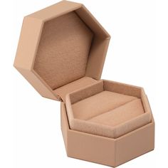 an open box that is sitting on a white surface, with the lid partially closed