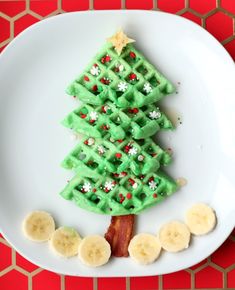 a waffle christmas tree on a plate with bananas