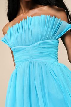 Making an entrance in the Lulus Undeniably Iconic Teal Blue Tulle Pleated Strapless Maxi Dress means you'll leave a lasting impression with your fabulous style! This statement-making dress features layers of pleated tulle that shape a strapless bodice (with hidden no-slip strips and supportive side boning), atop a lightly gathered, crisscrossing empire waist with twin cutouts at the sides. The flowy, A-line skirt boasts a voluminous silhouette as it falls to a sweeping maxi hem. Hidden back zipp Blue Mini Dress For Bridesmaid In Summer, Blue Mini Dress For Summer Bridesmaid, Blue Summer Bridesmaid Mini Dress, Blue Off-shoulder Mini Dress For Prom, Blue Pleated Prom Dress, Pleated Tulle, Fabulous Style, Lulu Fashion, Blue Tulle