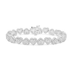 Reveal your romantic side in the most outstanding way when you wear this heart-shaped multi-diamond alternating line bracelet in white gold. Fashioned in cool 10K white gold Heart-shaped composites of round diamonds sparkle in a mirrored design along this continuous row. Halo frames of round diamonds surround each multi-diamond to complete this glamorous style. Breathtaking with 5 cts. t.w. of diamonds This 7.0-inch bracelet secures with a box clasp. Diamond Heart Bracelet, Heart Diamond Bracelet, Diamond Heart Charm Bracelet, Diamonds Bracelet, Diamond Frame, Glamorous Style, Box Clasp, Diamond Bracelets, Gold Heart