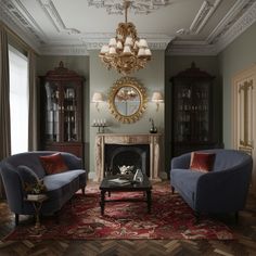 a living room with two couches and a fire place in it's center