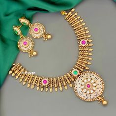 Indian gold necklace set with beautiful meenakari designs. Inspire your style with this real gold look wedding jewlery set with ruby and green stone details. Necklace is made with pure brass in antique gold finish. Pair this necklace with saree or lehenga to complete your look.  All orders Ship same day if placed before 4:00 PM EST  Earring length: 2.5 inch Earring width: 1 inch Necklace length: Adjustable with dori closure. Create beautiful memory for any occasion with elegant jewelry for your Multicolor Gold Plated Kundan Necklace With Meenakari, Multicolor Meenakari Kundan Necklace Gold Plated, Yellow Gold Round Bridal Necklace With Meenakari, Gold-plated Green Kundan Necklace With Meenakari, Green Kundan Necklace With Meenakari In Gold Plated, Green Kundan Necklace With Meenakari Detail, Festive Gold Plated Temple Necklace With Meenakari, Festive Gold-plated Temple Necklace With Meenakari, Festive Gold-plated Meenakari Temple Necklace