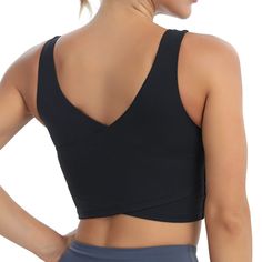 the back of a woman wearing a black sports bra