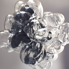 a bunch of clear glass balls sitting on top of each other