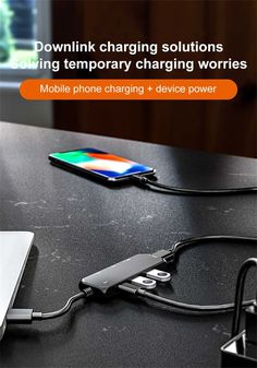 an image of a cell phone charging on a table with the caption's description below it