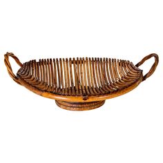 a large wooden basket with handles on white background