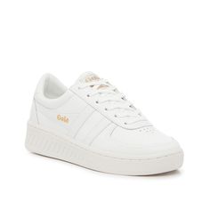 Gola-Grand Slam Sneaker - Women's Bring a sporty touch to casual fits with the Grand Slam sneaker from Gola. This low-top sports a monochromatic hue that is meant to match easily with fave ensembles. Complete with perforated details on the toe and stitched stripes. White Athleisure Sneakers For Tennis, White Tennis Sneakers For Spring, White Sportswear Sneakers, Dress Sandals Flat, Shoe Size Chart Kids, Bridal Wedding Shoes, Wide Width Shoes, Trending Sneakers, Grand Slam