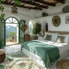 a bedroom with a bed, rugs and potted plants on the floor in front of an open door