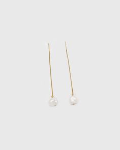 Meet these elegant and classic pearl threader earrings. Handcrafted in gold-filled threader earrings with freshwater pearls. Each pearl is handpicked to let the unique shape shine through. Each pearl is unique and slightly varies in size and shape — and that's the beauty of it. …………………………………. I T E M D E T A I L S • Sold as a pair • Threader length is 80mm (without the pearl) • Pearl is genuine freshwater Keshi pearl (10 x 9 mm)• Tarnish-resistant, showerproof, safe for sensitive ears • 14K Gold Elegant 14k Gold Filled Pearl Drop Threader Earrings, Elegant 14k Gold Filled Long Drop Threader Earrings, Classic Gold Threader Earrings With Pearl Drop, Classic Dangle Threader Earrings, Elegant Long Drop Threader Earrings With Adjustable Chain, Elegant Threader Earrings With Long Drop And Adjustable Chain, Delicate Gold Threader Earrings With Pearl Charm, Yellow Gold Long Drop Threader Earrings With Pearl Drop, Yellow Gold Threader Earrings With Pearl Drop