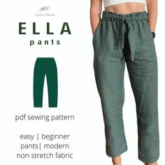 a woman wearing green pants and white top with the words ella pants on it's side