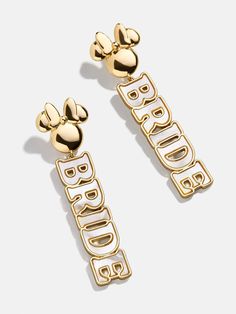 two gold mickey mouse ear clips with the words happy birthday written in large letters on them