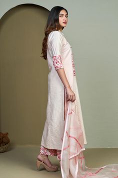 Peach woven chanderi kurta with flower embroidery on the yoke and cuffs. Paired with a pant with flower embroidered hem. Comes along with a dupatta.
Components: 3
Pattern: Placement Embroidery
Type Of Work: Flower
Neckline: Round Neck
Sleeve Type: Three Quarter Sleeves
Fabric: Woven Chanderi
Color: Peach
Other Details: 
Leaf line embroidery on dupatta
Occasion: Puja - Aza Fashions Cotton Anarkali Set With Traditional Drape For Transitional Season, Transitional Anarkali Set With Traditional Drape, Unstitched Handloom Palazzo Set For Eid, Festive Handloom Palazzo Set With Straight Kurta, Cotton Sharara For Designer Wear, Transitional Season, Transitional Cotton Anarkali Set With Pallu, Designer Cotton Dupatta For Transitional Season, Traditional Cotton Silk Kurta, Handloom Chanderi Straight Kurta